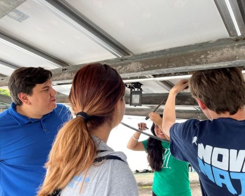 Students connecting solar panels