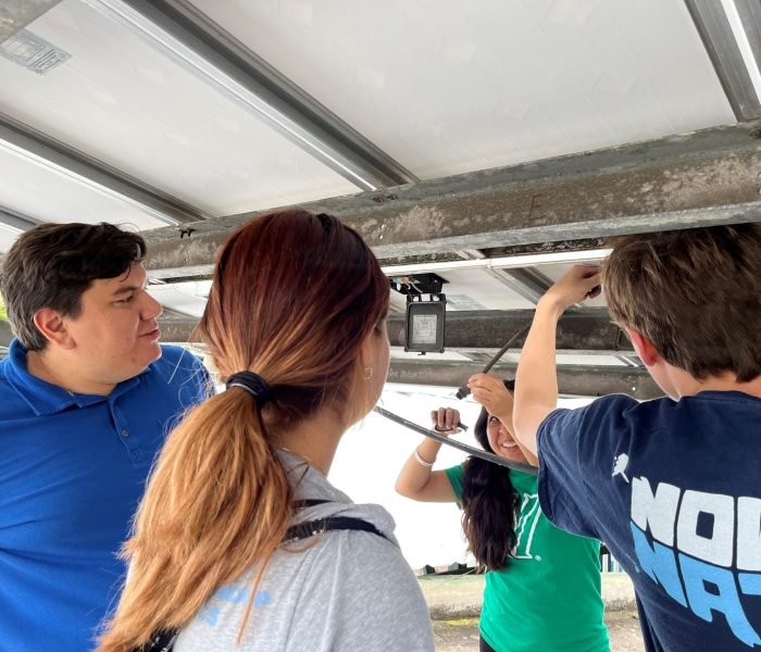 Students connecting solar panels
